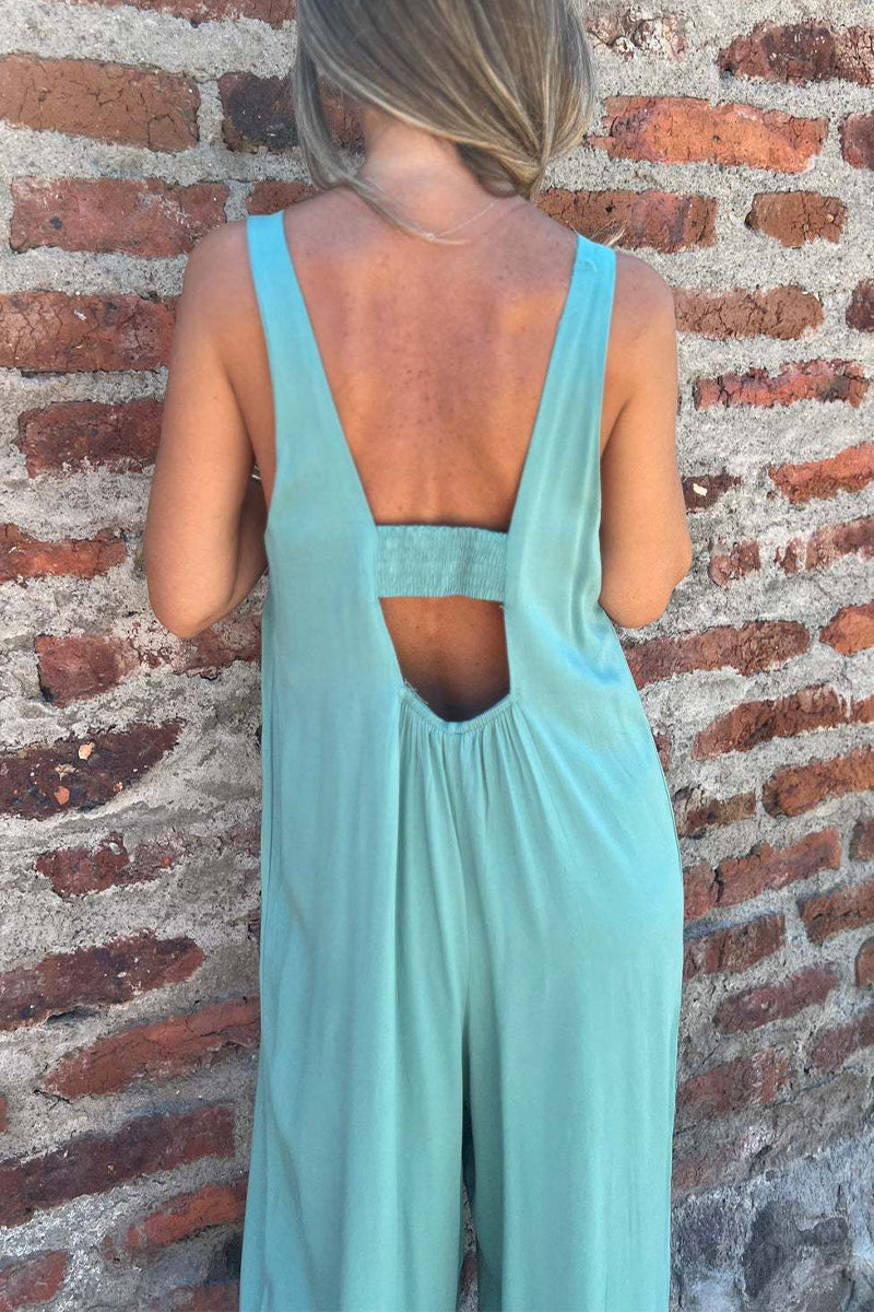 CM | Casual Color Sólido Bolsillo Botones Sin Espalda Cuello U Boot Cut Jumpsuits