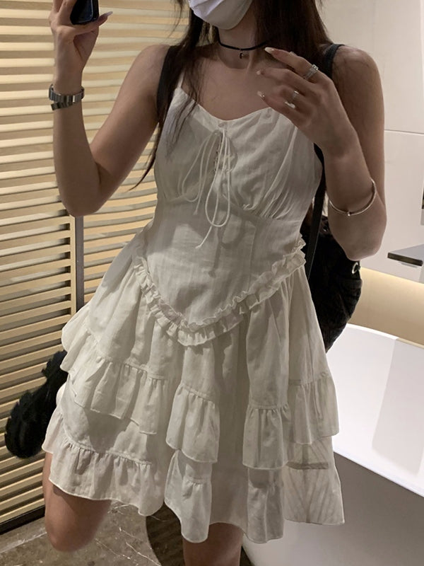 CM | Mini vestido blanco con volantes