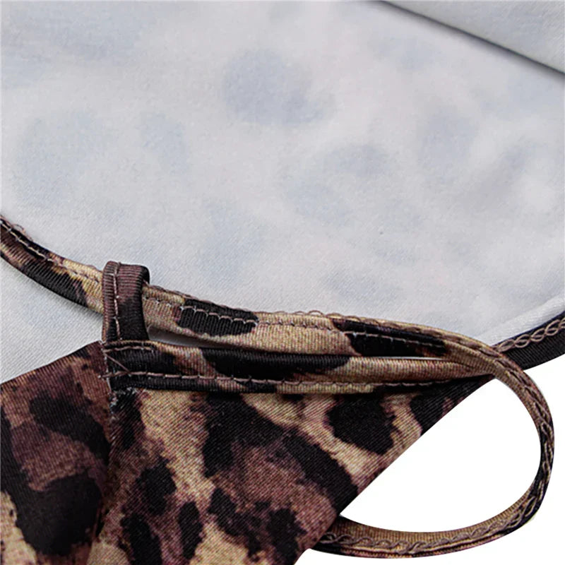 CM | Vestido midi con estampado de leopardo y tirantes cruzados