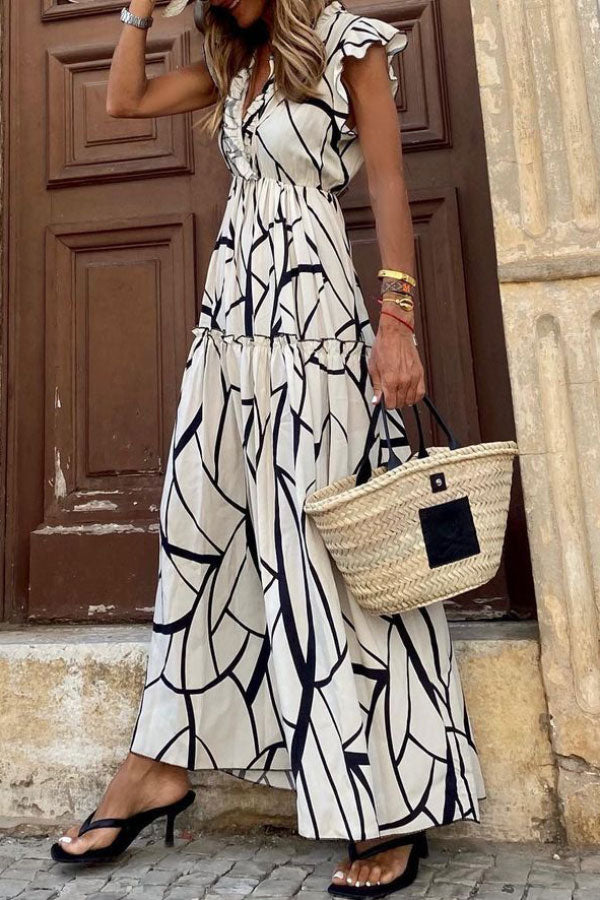 CM | Vestido midi de volantes con estampado geométrico y cuello en V