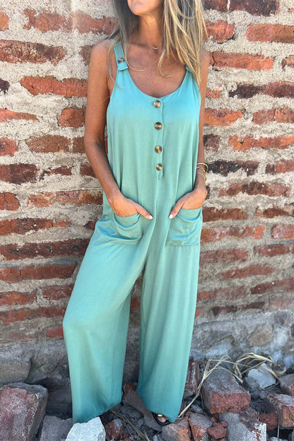 CM | Casual Color Sólido Bolsillo Botones Sin Espalda Cuello U Boot Cut Jumpsuits