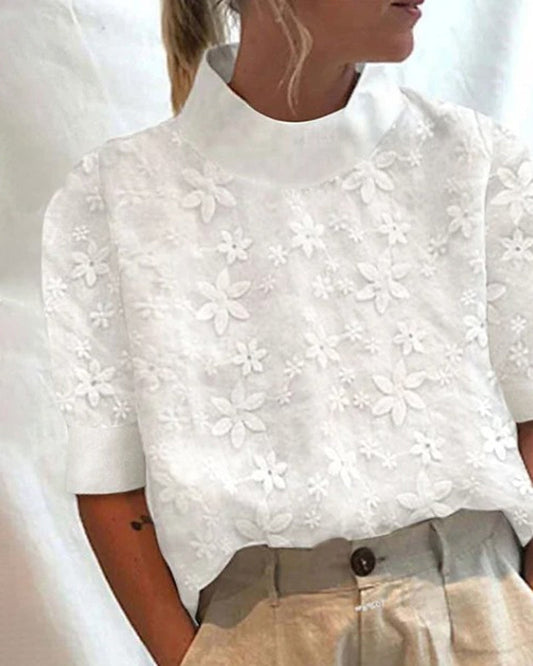 CM | Blusa bordada con cuello alto sencillo