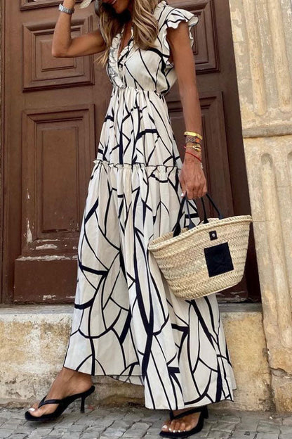 CM | Vestido midi de volantes con estampado geométrico y cuello en V
