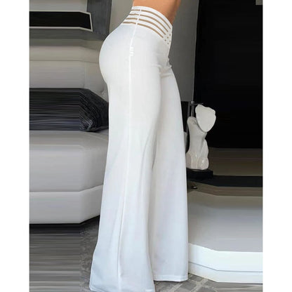CM | Pantalones acampanados de elastano con cintura cruzada