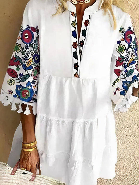 CM | Minivestido de flecos con estampado floral y escote en V